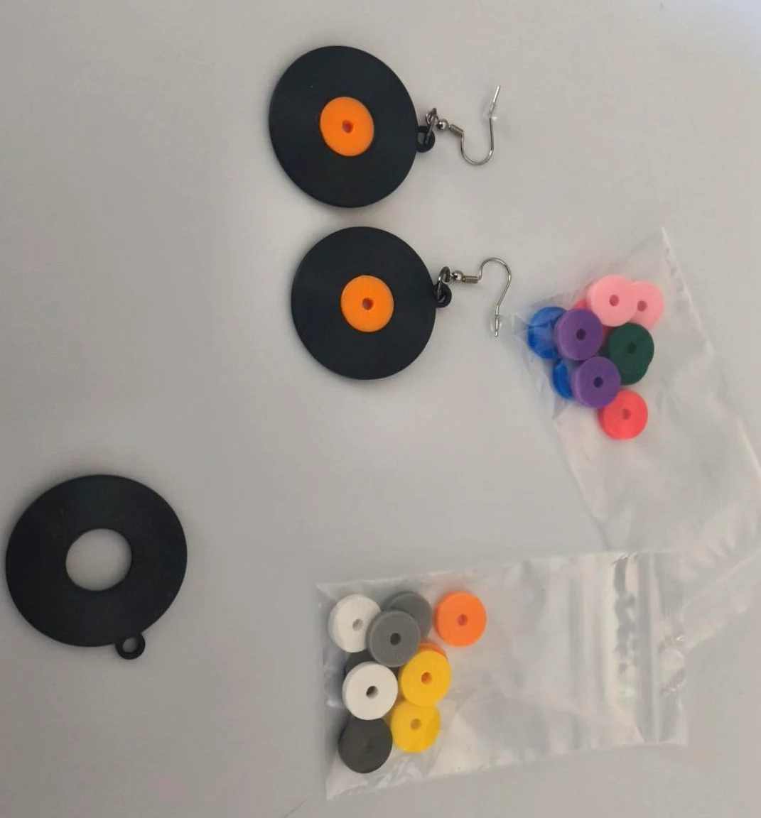 Record earrings with colorful extra center inserts in bags